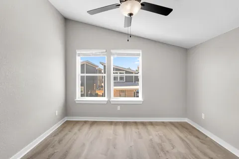 Bedroom under a vaulted ceiling