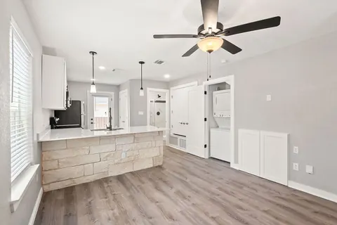 Living room and kitchen with the limestone island