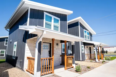 Board and batten siding along the front of the homes