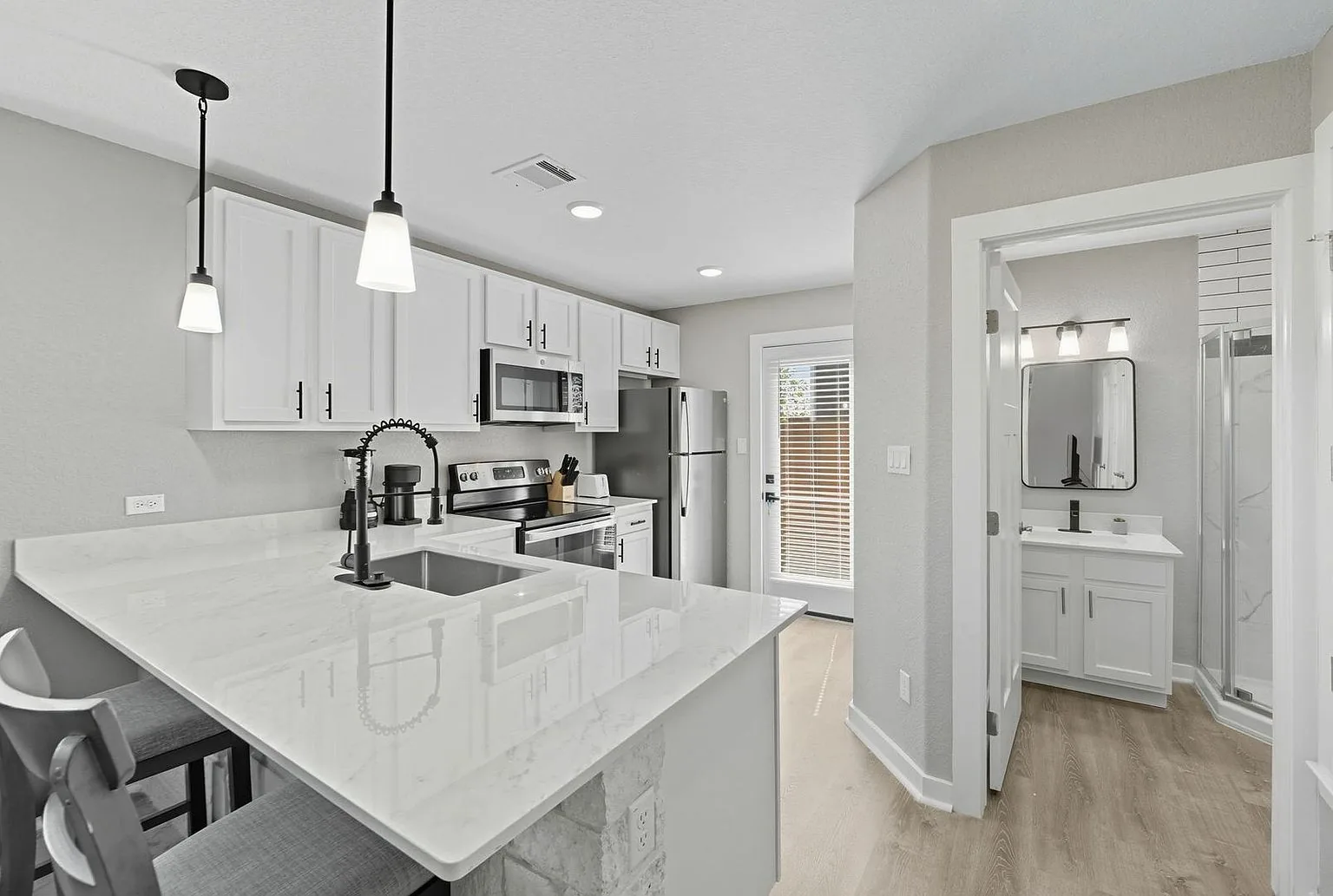 Kitchen island toward bath, 20 Tate Lane, Round Rock