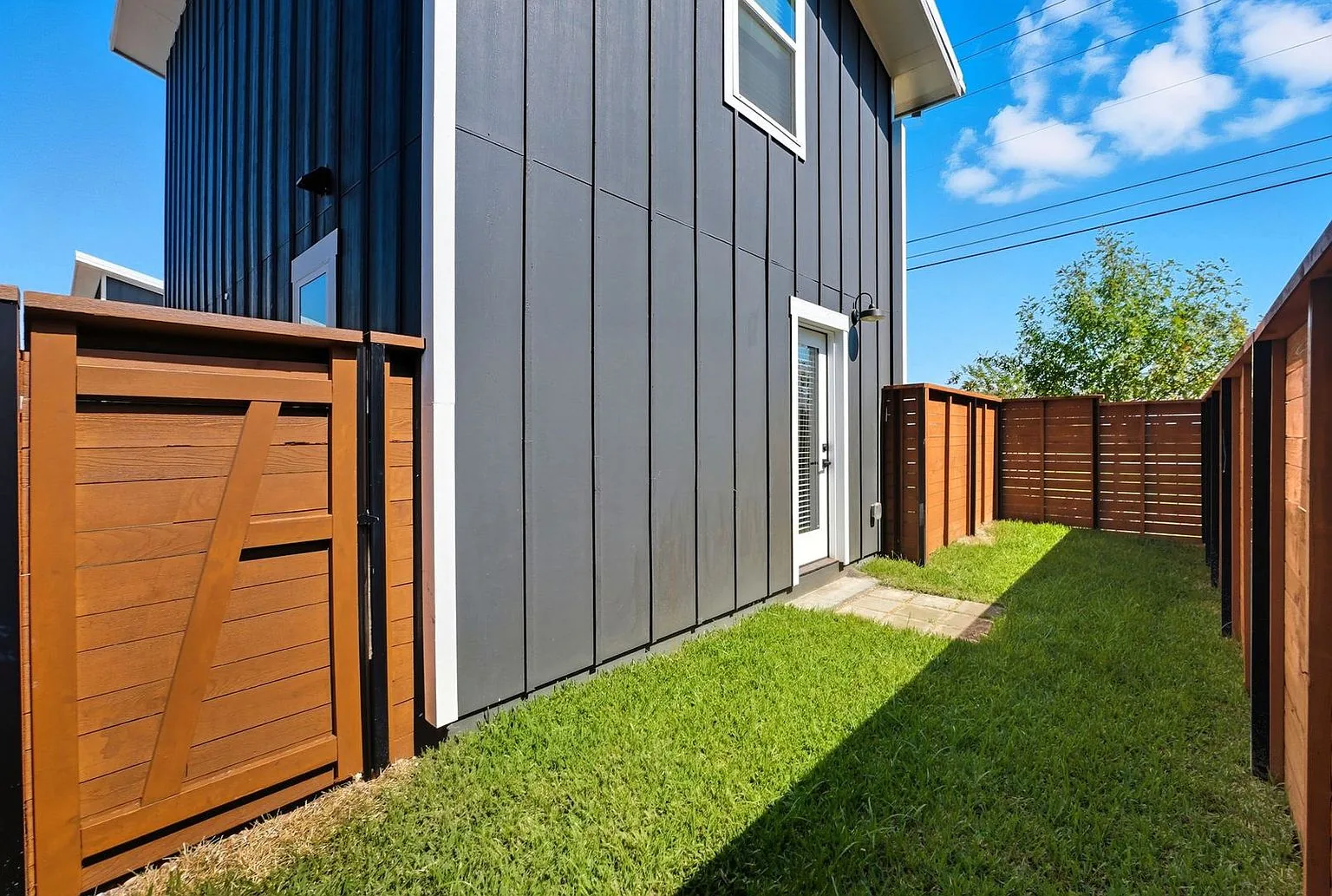 Backyard gate and new sod, 20 Tate Lane, Round Rock