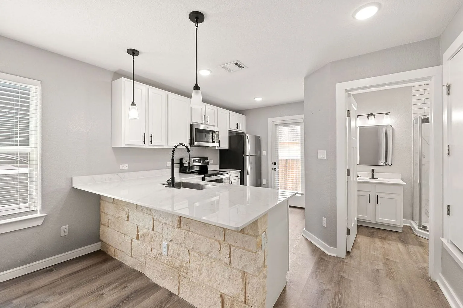 Kitchen island toward bath, 20 Tate Lane, Round Rock
