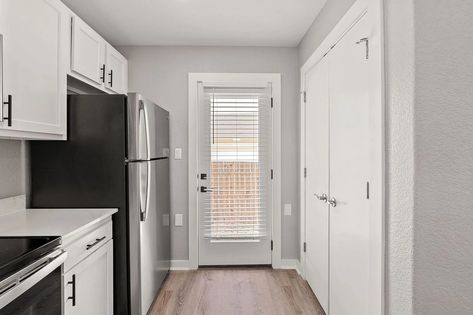 Kitchen toward back door, 20 Tate Lane, Round Rock