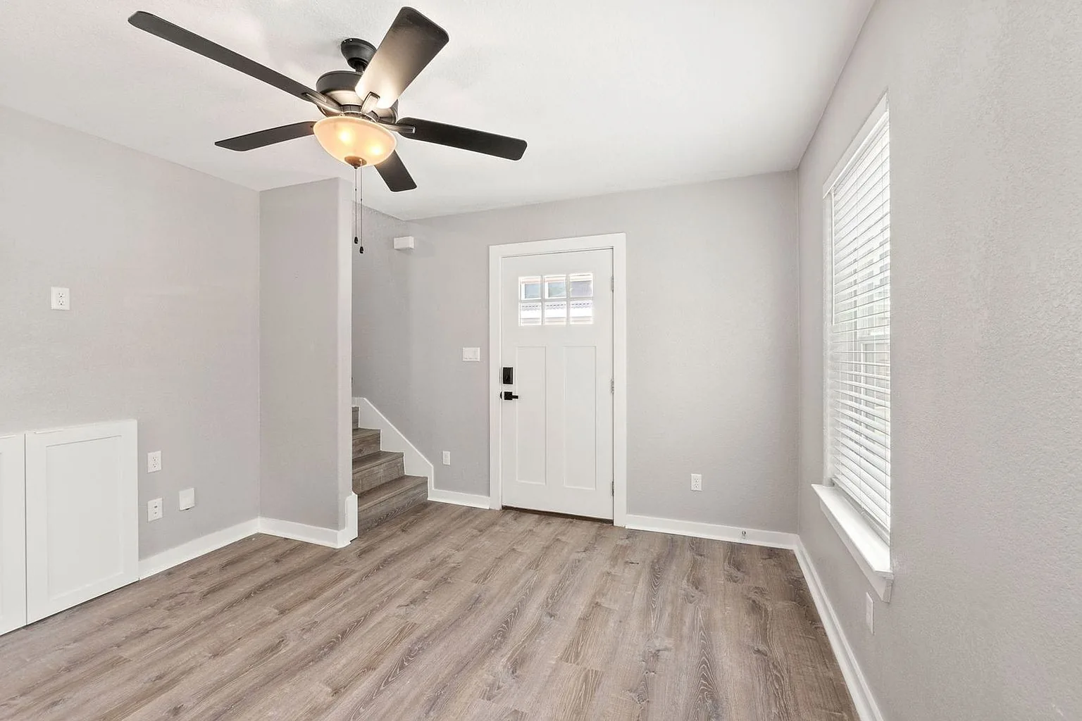 Living toward front door stairs, 20 Tate Lane, Round Rock