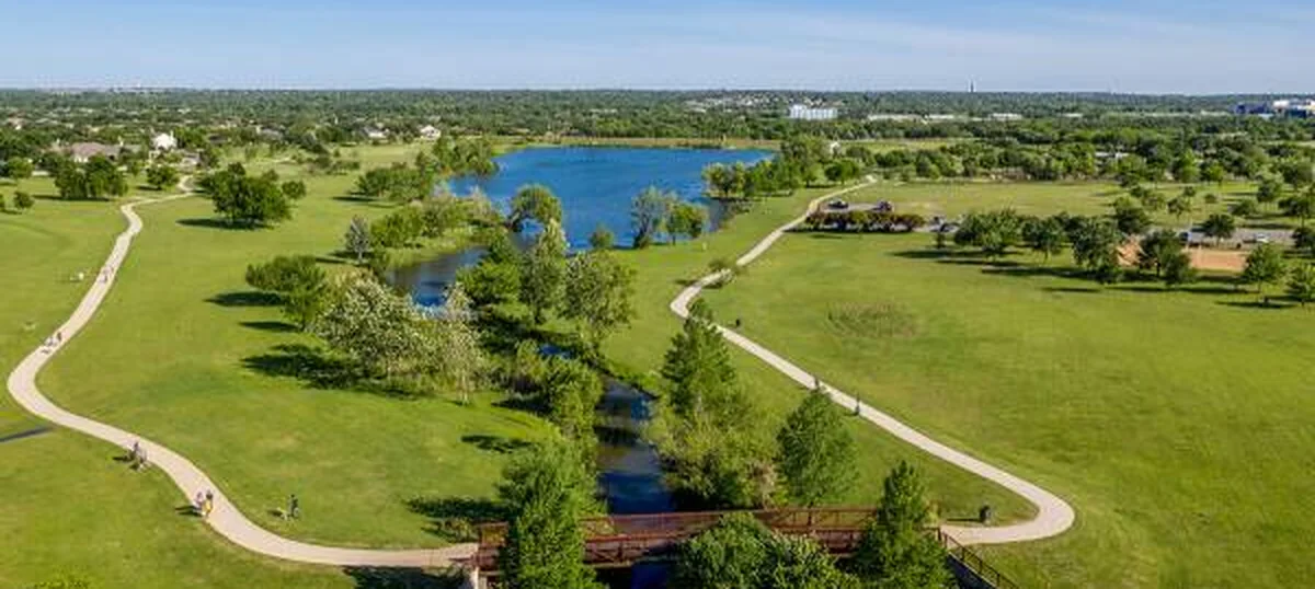 Aerial view of the pond, trails and footbridge at Old Settlers Park, Round Rock