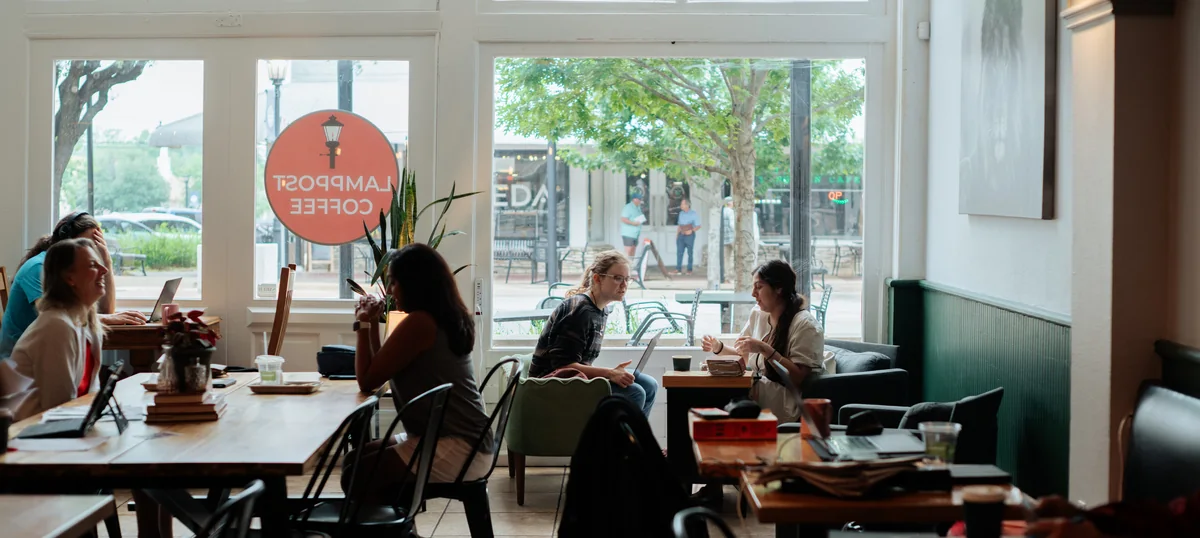 Inside Lamppost Coffee on East Main Street, Round Rock, with people at the window tables