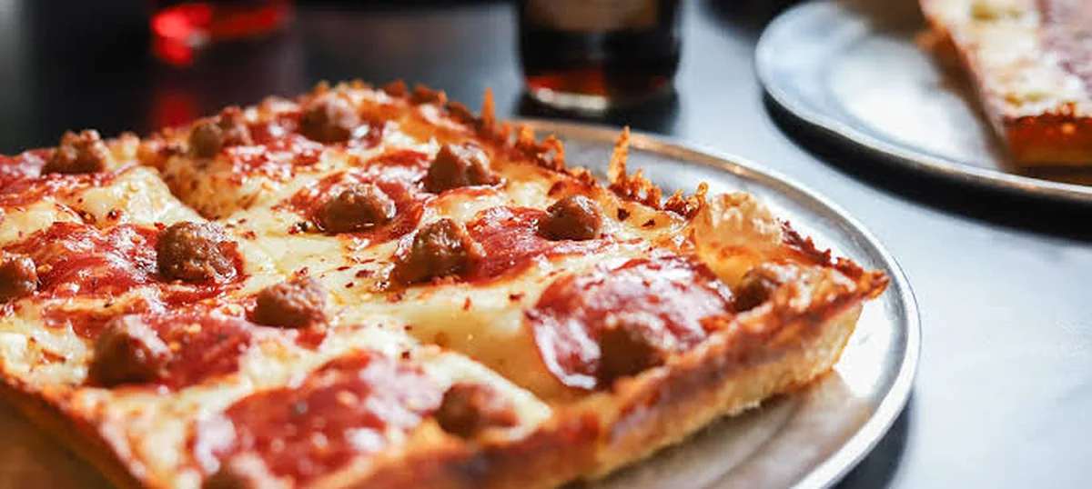 A Detroit-style square pizza on its pan at Via 313