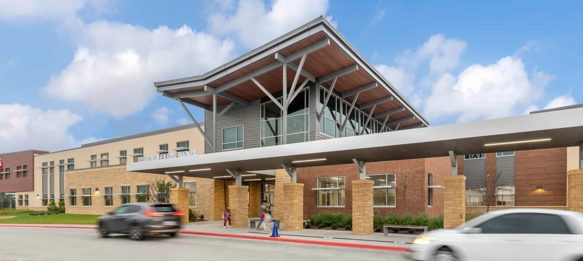The covered drop-off canopy and entrance at Redbud Elementary School, Round Rock