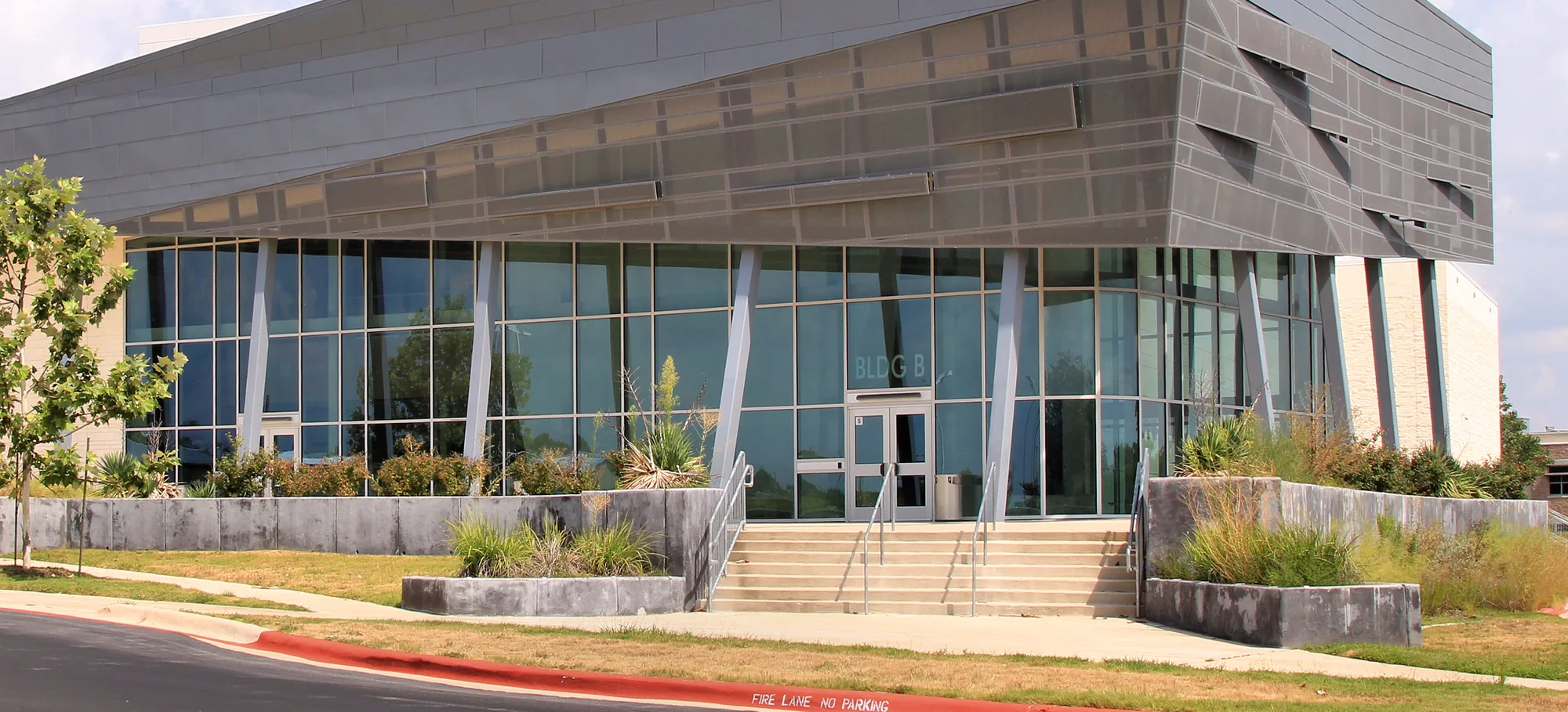 The entrance steps and glass frontage of Stony Point High School in Round Rock, Texas